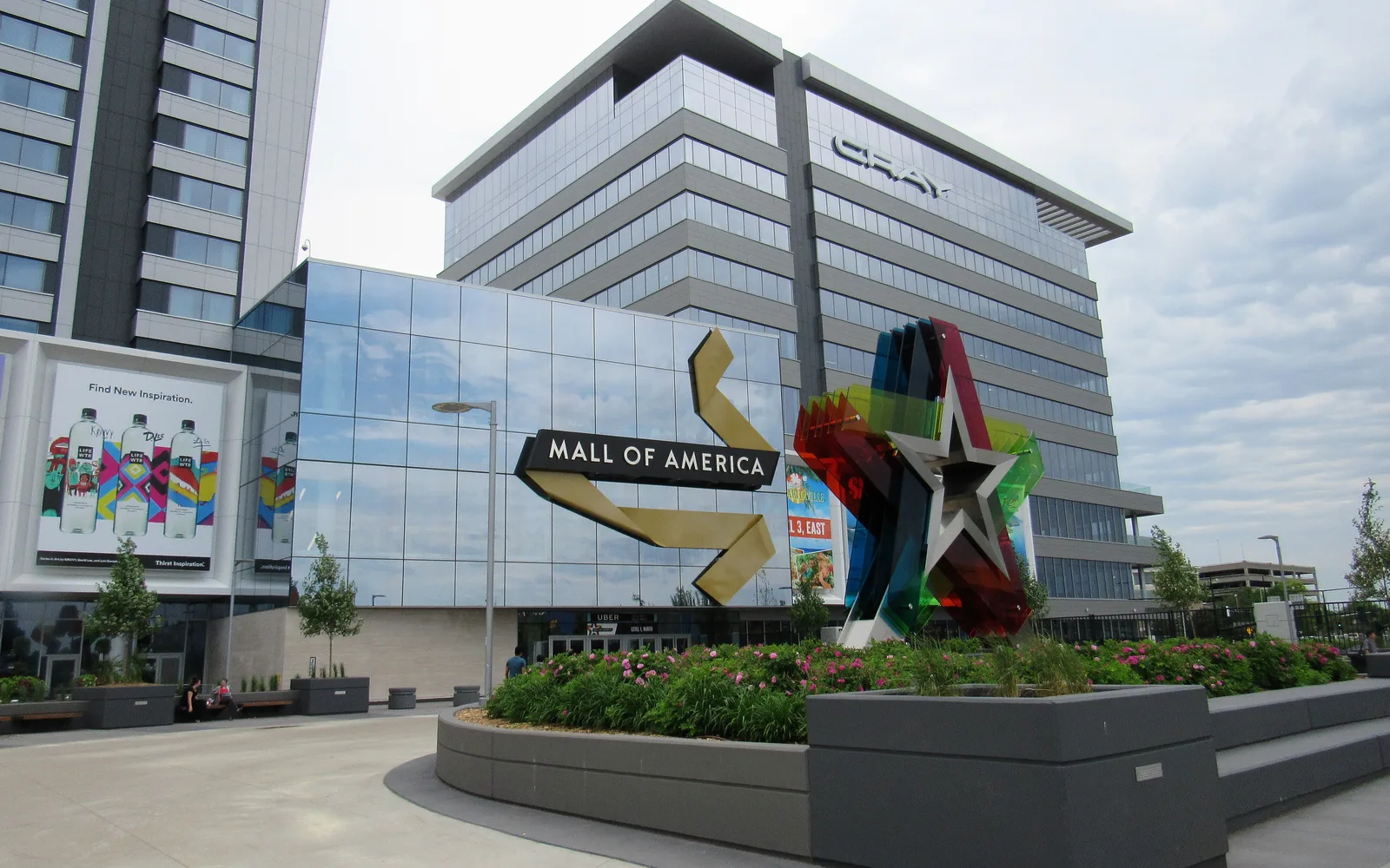 Exterior view of a large shopping mall in an urban setting